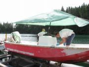 Max and Adam repair boat